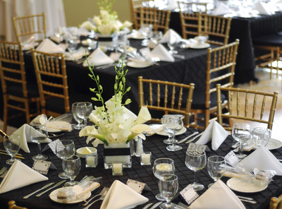 Formal table setting with napkins and floral arrangements
